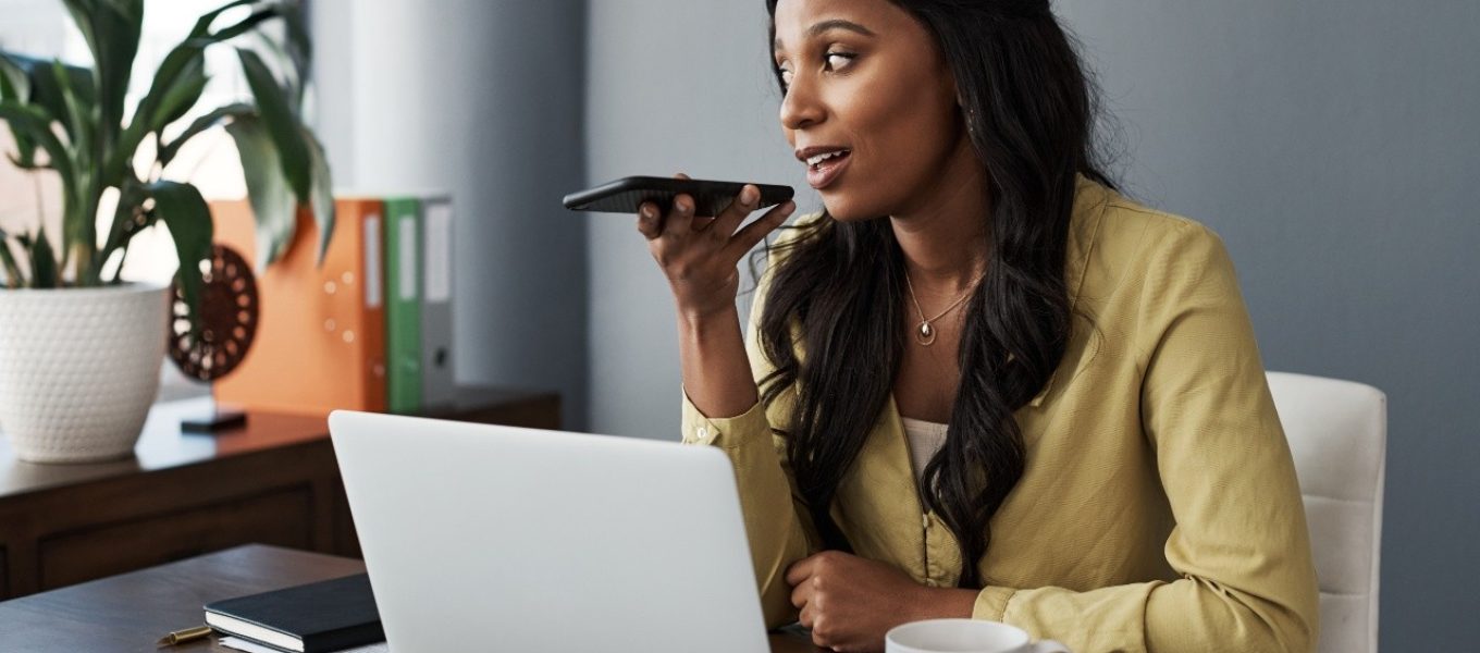 brown-haired-businesswoman-voice-typing-her-ideas-into-notes-masolata-r31ngkyduyr8cybrz9sukainnjwt4vrsga4fy5o4ts